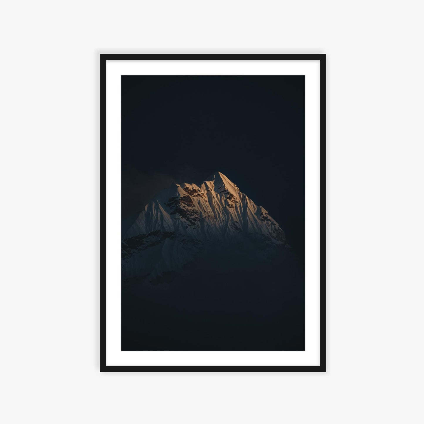 Ama Dablam emerging through the clouds