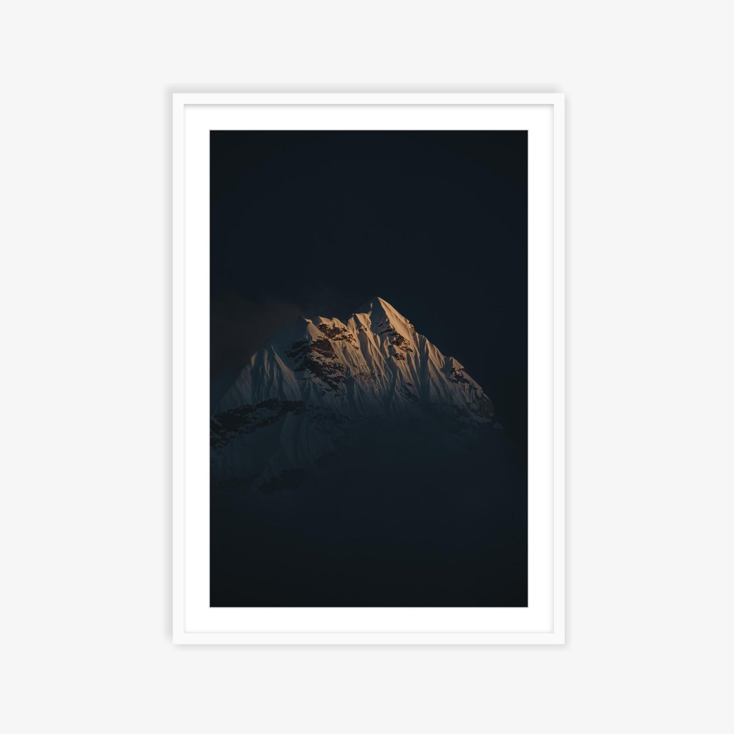 Ama Dablam emerging through the clouds