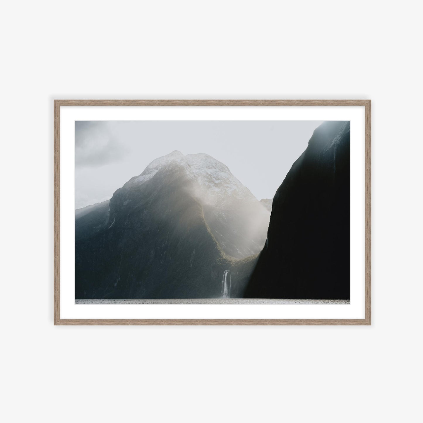 Burst of sunlight into Milford Sound