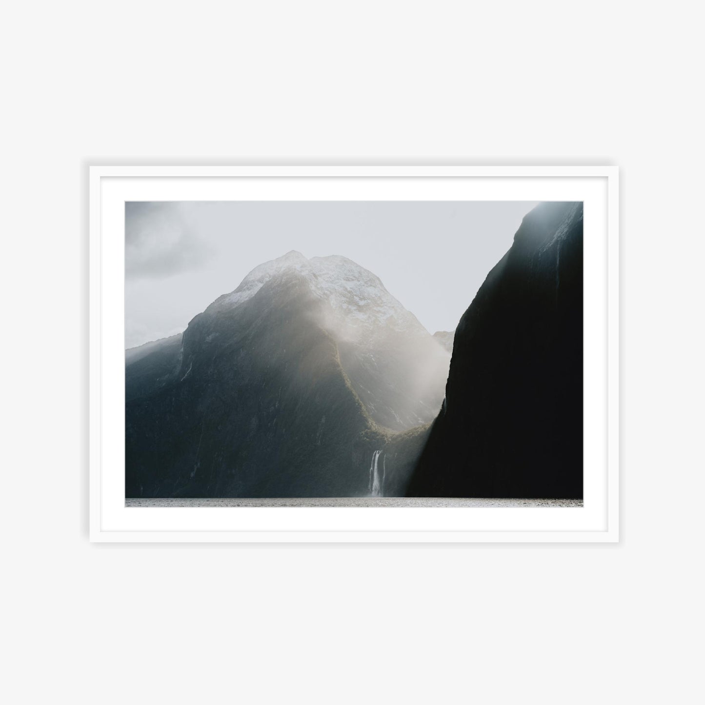 Burst of sunlight into Milford Sound